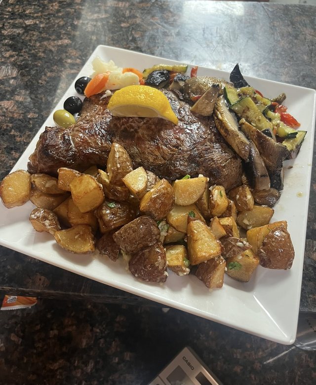 Grilled steak with roasted potatoes & vegetables at Churrasqueira Ribatejo